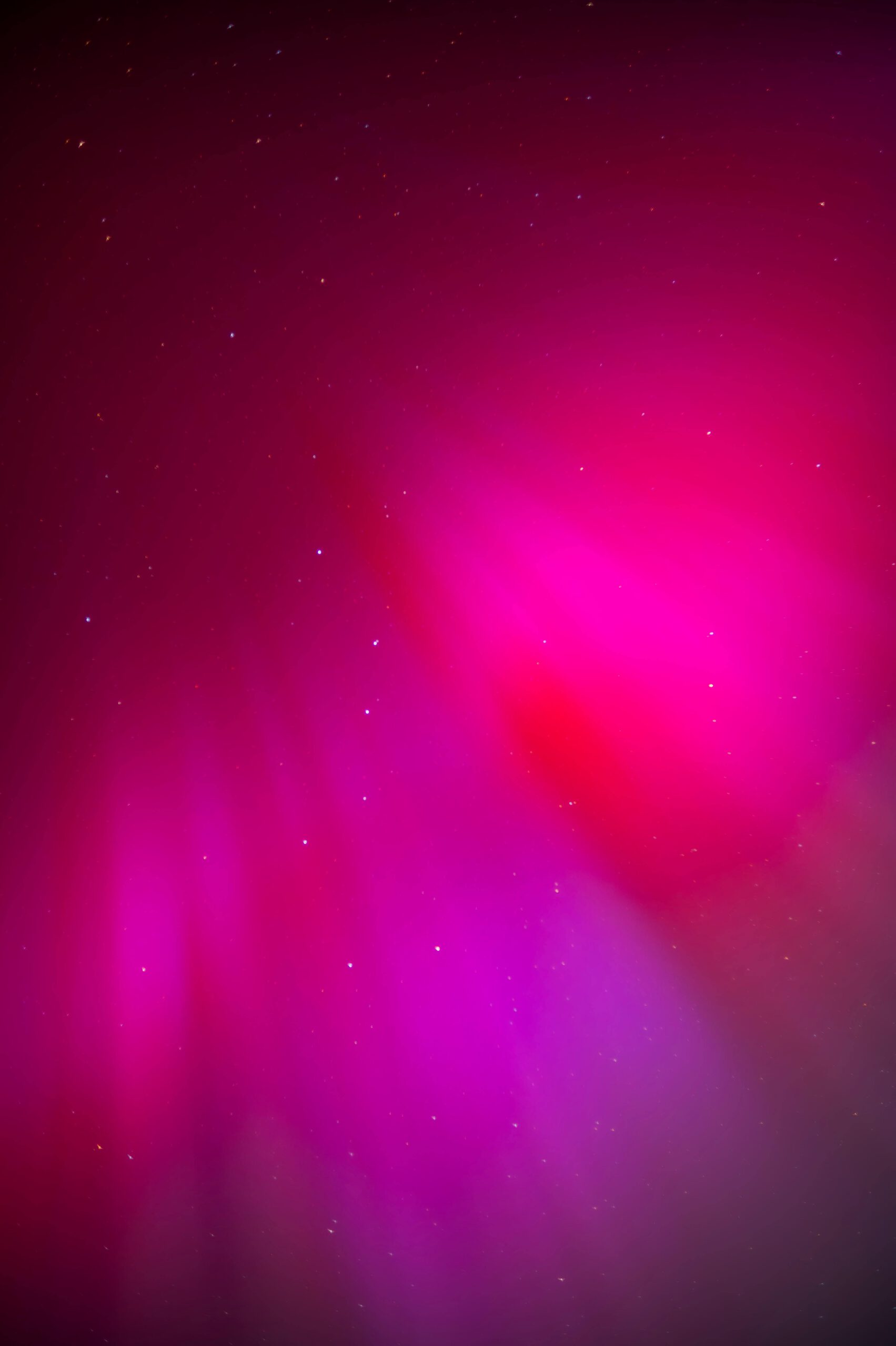 Stunning display of pink northern lights illuminating the sky in Leipzig, Germany.